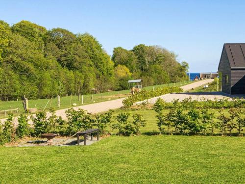 a park with a bench in the middle of a field at 10 person holiday home in Haderslev-By Traum in Haderslev