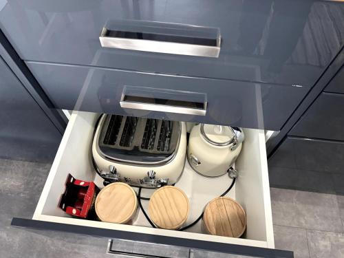a drawer in a kitchen with a stove at Erin's Bunker Charming Chalet next to Golf Club in Australind