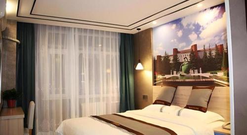 a bedroom with a bed with a painting on the wall at City 118 Selected Hotel Xi'an Fengcheng Nan Road in Xi'an