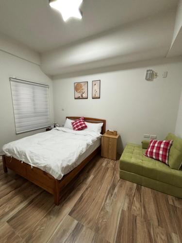 Postel nebo postele na pokoji v ubytování Xunfeng B&B