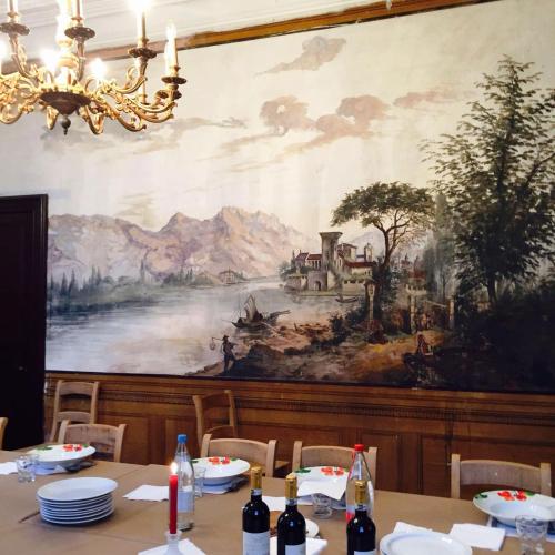 a painting on the wall of a dining room at De Oude Pastorij in Maarkedal