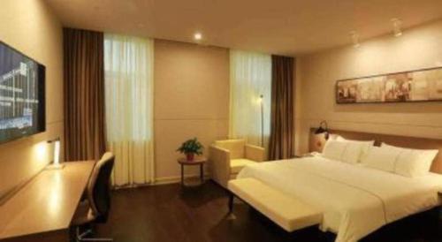 Katil atau katil-katil dalam bilik di Jinjiang Inn Select Heze Wanxiang Plaza Guiling Road