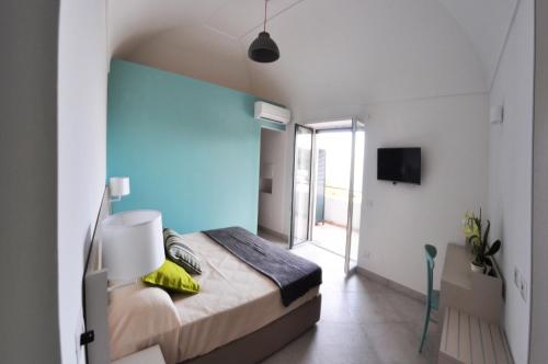 Кровать или кровати в номере Casa Costanza