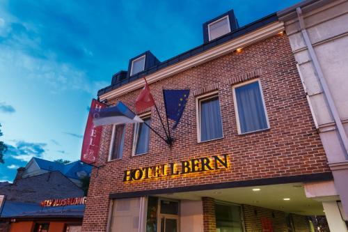 a brick building with a sign for a bar at Bern Boutique by Rikas Hotels in Tallinn