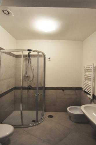 a bathroom with a shower and a toilet and a sink at Casa Costanza in Capri