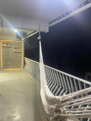 a hammock hanging from a wall in a room at apartment in Condesa Caracol Acapulco in Acapulco
