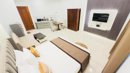 Televisyen dan/atau pusat hiburan di Sunrise Hill Apartment