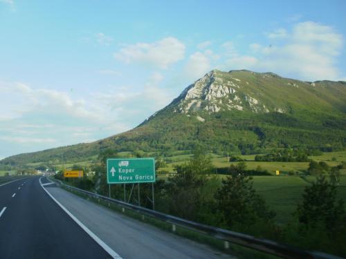 a highway sign on the side of a mountain at Rooms Jurca in Postojna