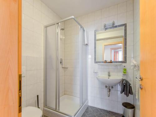 a bathroom with a shower and a toilet and a sink at Apartment in Tyrol in an attractive area in Fiss