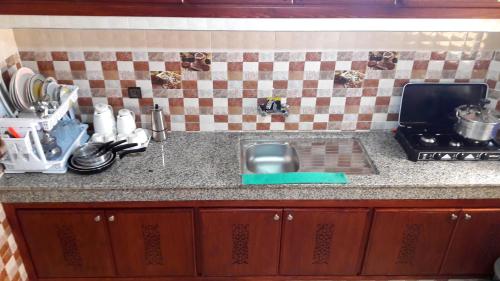 Una cocina o cocineta en Reem