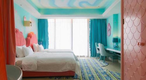 Postel nebo postele na pokoji v ubytování Mangrove Tree Resort World Qingdao