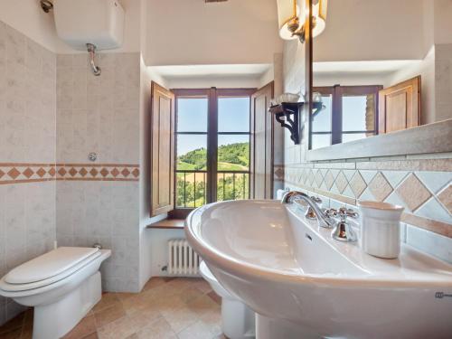 a bathroom with a sink and a toilet at Peaceful Getaway in Frontino in Frontino