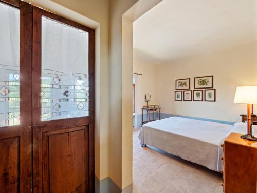 a bedroom with a bed and a door at Peaceful Getaway in Frontino in Frontino