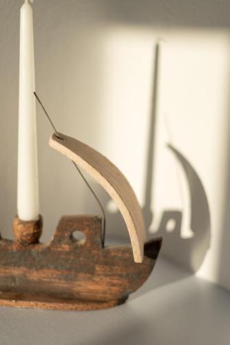 a candle holder with two candles on top of it at Aria Suites & Villas in Fira