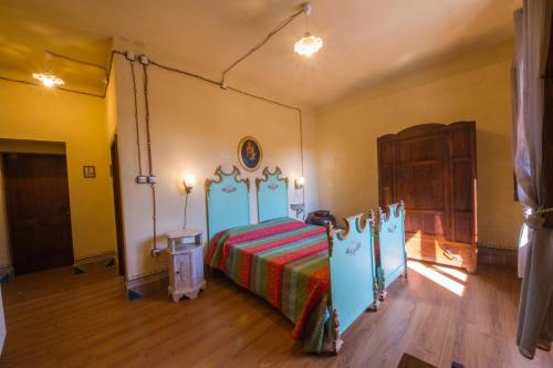 Ένα ή περισσότερα κρεβάτια σε δωμάτιο στο Sansepolcro Rooms Rent