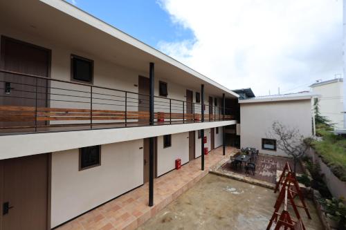 an external view of a building with a balcony at Zemulong Inn - Shangri-La, Dukezong Ancient Town, Moonlight Plaza in Shangri-La