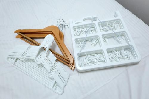 a white plastic tray with a pair of tongs at Oakville Nezu by Tranova in Tokyo