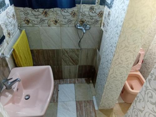 a bathroom with a sink and a toilet at Silonya Forest Edge in Nuwara Eliya