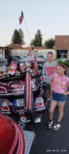 a group of people standing next to a motorcycle at Aba-Böbe Vendégház in Zalaszentiván
