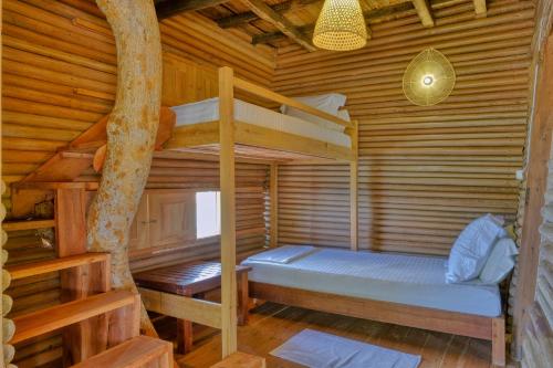 Postel nebo postele na pokoji v ubytování Sangany Lodge