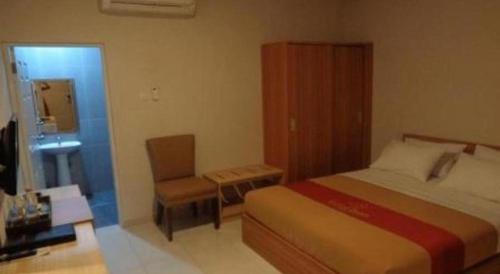 Postel nebo postele na pokoji v ubytování Grand Dian Hotel Slawi