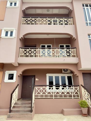 a building with a staircase and a balcony at Hayat Apartments & Homes in Lagos