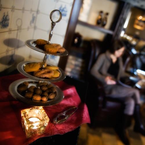 a tray of cookies and pastries on a table at Hotel De Oude Brouwerij in Mechelen