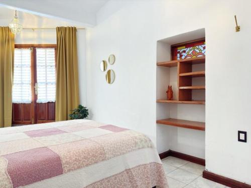 Postel nebo postele na pokoji v ubytování El Viejo Café - House with terrace and colonial charm