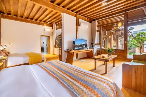 Televisyen dan/atau pusat hiburan di Jian Chuan Sha Xi Sha Ping Having You In This Life NO.2Courtyard