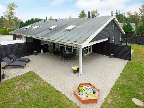 an overhead view of a house with a roof at 12 person holiday home in Væggerløse-By Traum in Marielyst