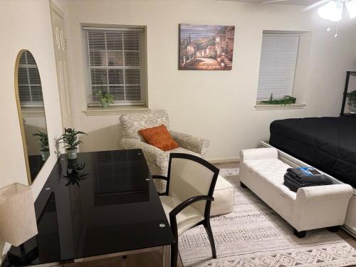 a living room with a desk and a couch at Hampton cozy house near Langley AFB in Hampton