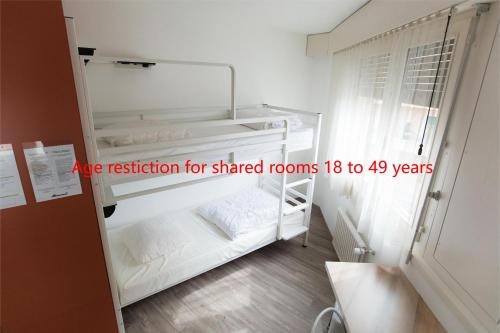 Letto o letti in una camera di City Hostel Geneva