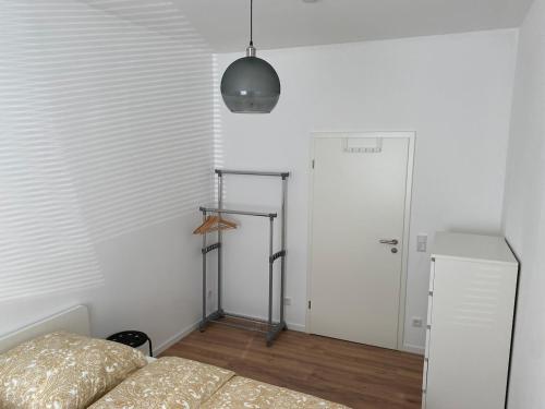 a bedroom with a bed and a white door at Heart of Essen in Essen