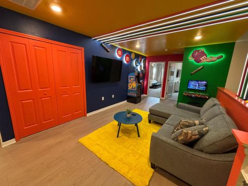 a living room with a couch and a tv at 5 Bedrooms 45 Baths Windsor Cay 16146Cc in Clermont