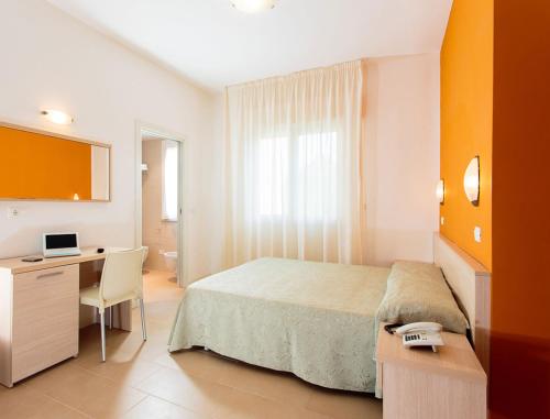 A bed or beds in a room at Hotel Villa Ombrosa