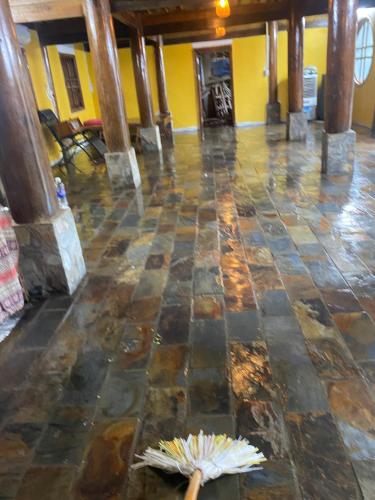 an empty room with a floor with a fan on it at Xóm Cảng homestay-Thac Ba lake in Yên Bái