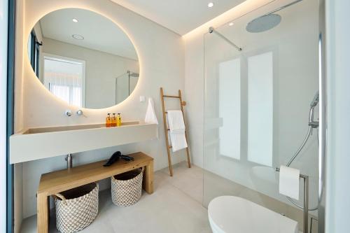 a bathroom with a sink and a mirror at Tropical Garden on City Center in Funchal