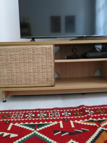 TV a/nebo společenská místnost v ubytování Le Coin des 3 Étoiles