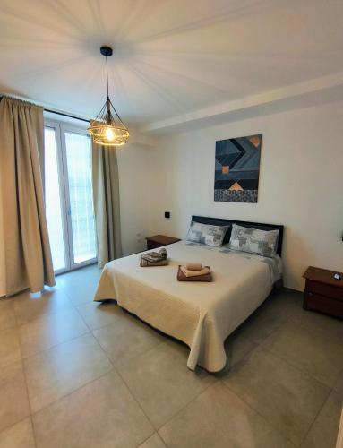 a bedroom with a large bed with two towels on it at Interno 7 in Barletta