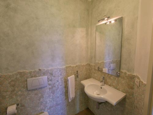 a bathroom with a sink and a mirror at Mansion in San Valentino with Pool in San Valentino in Abruzzo Citeriore