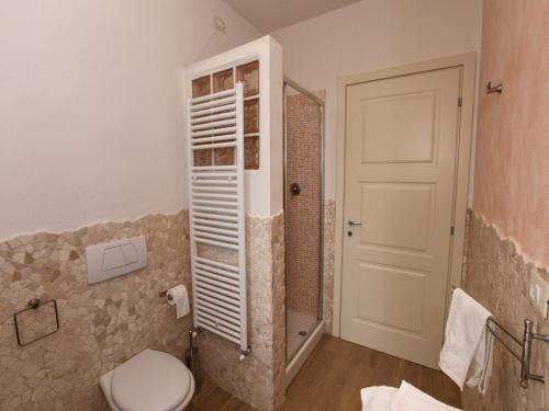 a bathroom with a toilet and a shower at Mansion in San Valentino with Pool in San Valentino in Abruzzo Citeriore