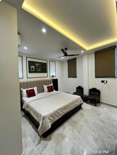 a bedroom with a large bed in a room at Khas Mahal Homestay in Agra