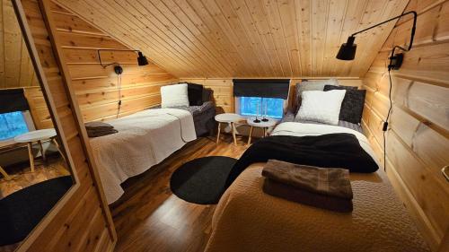 Postel nebo postele na pokoji v ubytování Peaceful Hideaway near Levi Adventures activities