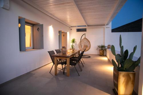 a dining room with a table and chairs at Galanos villa in Krotiri