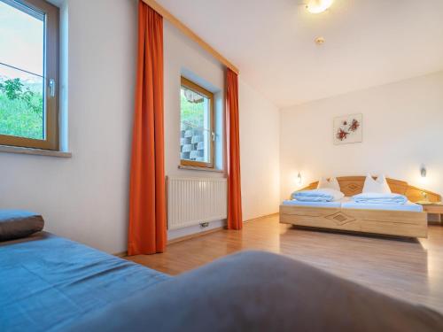 a bedroom with two beds and a window at Apartment in Neustift in a quiet location in Neustift im Stubaital