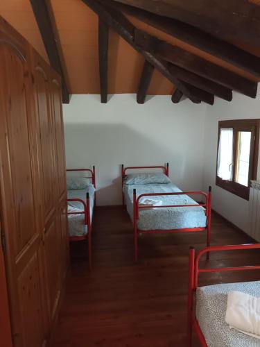 a room with two beds and a window at Isola della Cona - Riserva naturale Foce dell'Isonzo in Staranzano