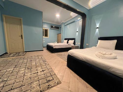 Postel nebo postele na pokoji v ubytování New pyramid inn