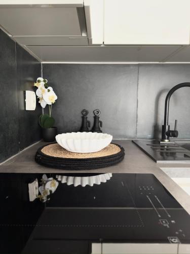 a sink in a kitchen with a white bowl at Romantic 3 Bedroom Apartment 3min from the beach in Kruševo