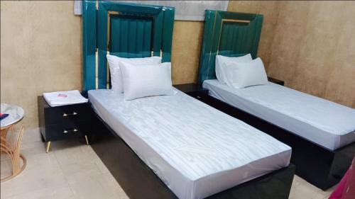 Postel nebo postele na pokoji v ubytování Hotel Moon River