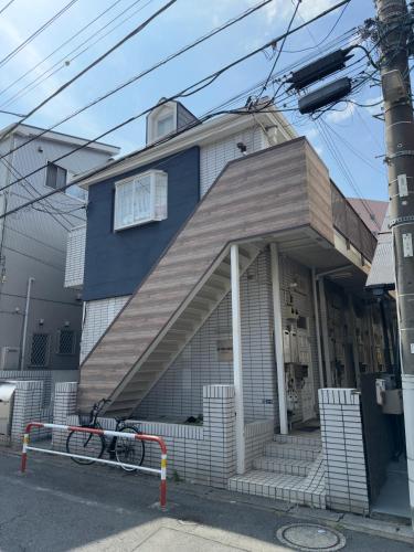 a house with a bike parked in front of it at D Regalo in Ichikawa